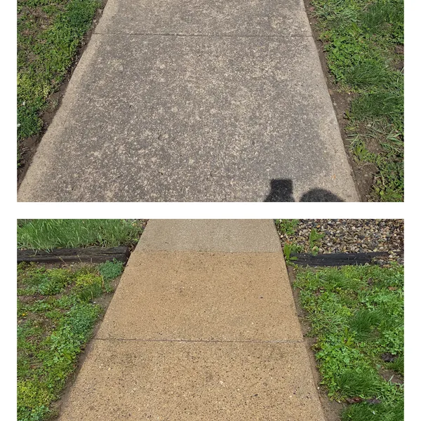 Before and after pressure washing of a stained concrete sidewalk at a fire station