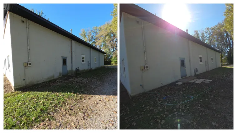 Before and after: the long side of a white block building, the dull grey film along its length cleaned off