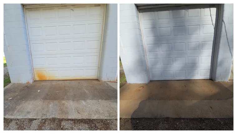Before and after: rust stains washed off the bottom of a white garage door and the concrete apron cleaned