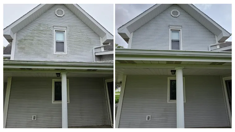 Before and after: a two-storey farmhouse gable and porch soft washed free of green algae