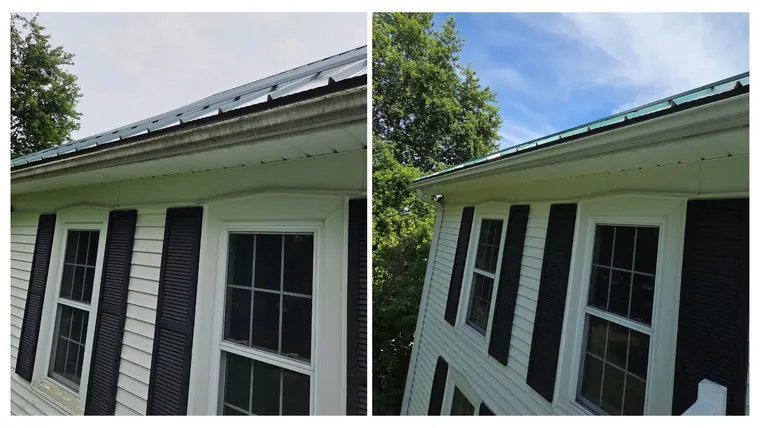Before and after: farmhouse windows, soffit and the green metal roof edge cleared of dirt and algae