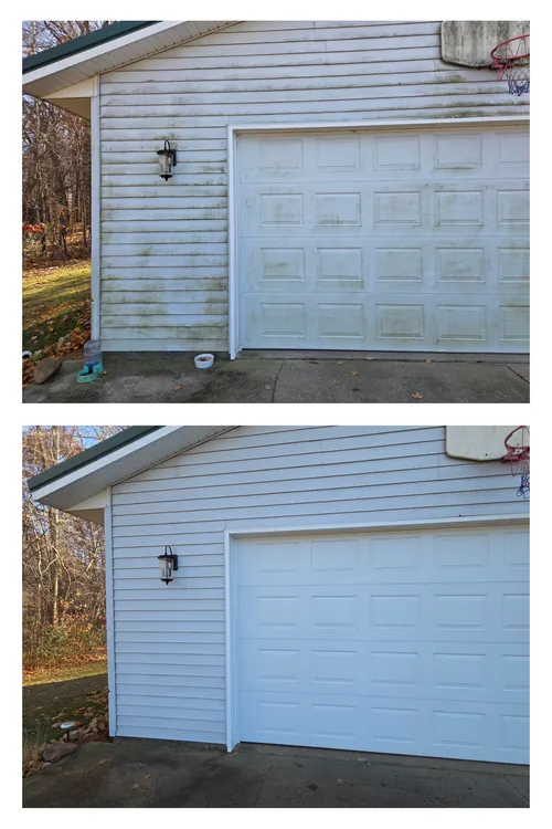 Before and after: green algae streaks soft washed off the side wall of a detached garage