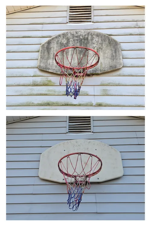 Before and after: a basketball backboard on heavily algae-covered siding, both washed clean