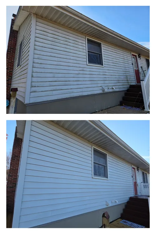 Before and after: the long side of a ranch house, the green algae along its lower siding washed off